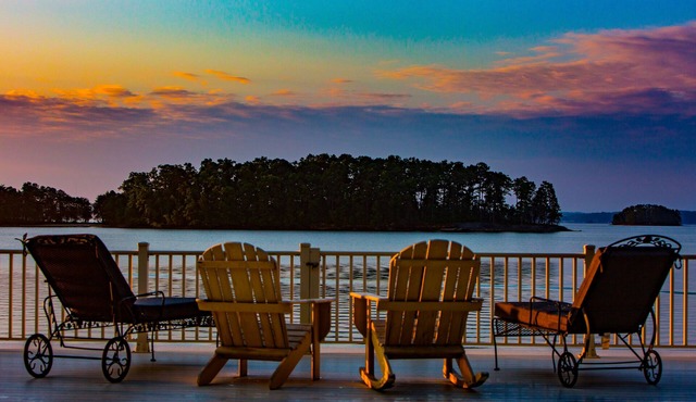 Luxury lake home, private sandy beach, huge covered double dock.