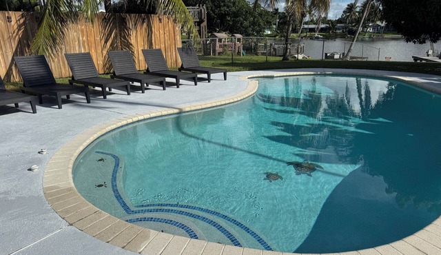 Luxury Lakefront Retreat with Heated Pool, Tiki Lounge, Dock, Gym & EV Charger