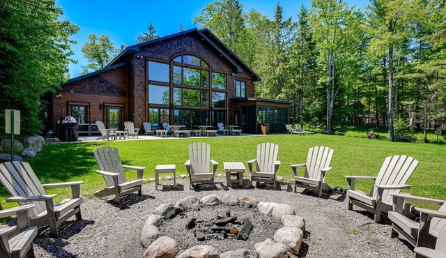 Luxury lakefront home with high-speed WiFi, dock, private beach, & theater room