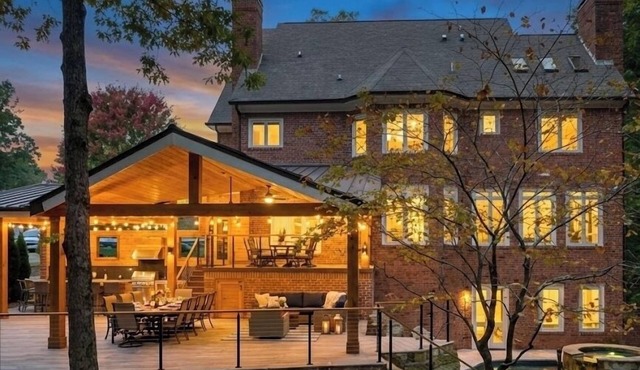 Luxury Lakefront retreat. Privacy gate, pool and outdoor kitchen