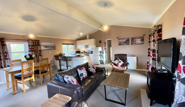 Luxury lodge situated on a tranquil holiday park