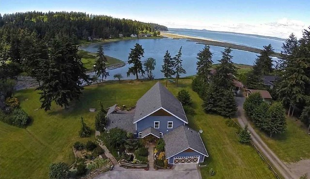 Luxury Lodge Style Custom Home on Private Oceanfront Lagoon Acreage.