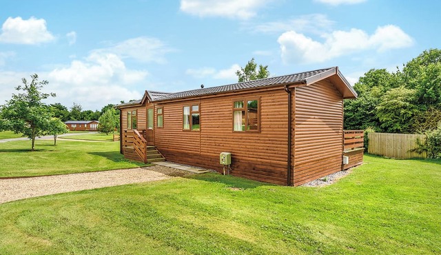 Luxury lodge with king-size bed with en suite shower.