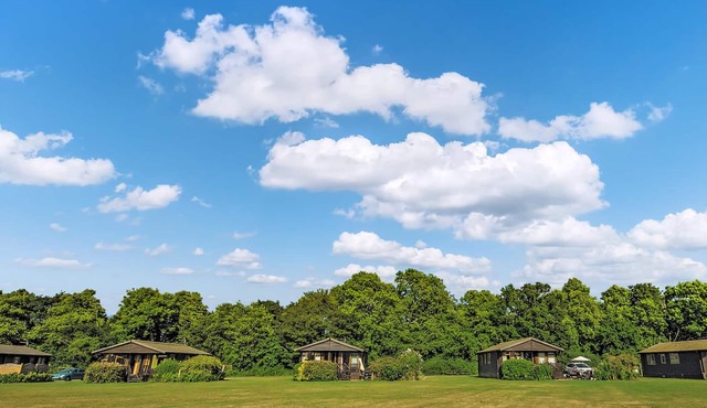 Luxury lodge with one double with en suite shower and two twin.