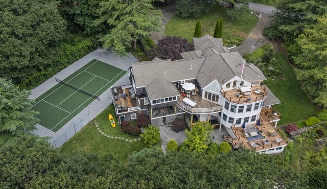 Luxury oceanfront estate with speakeasy, rooftop deck, tennis court & private beach.