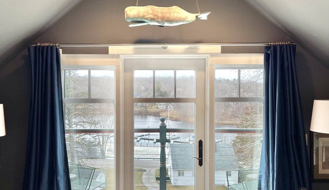 Luxury one bedroom with private roof deck overlooking River in Westerly, RI.