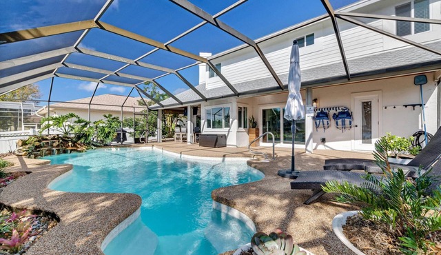 Luxury Pool Home | Boat Dock | Canal Home | Recently Updated | Close to Golf | WIFI | Heated Pool