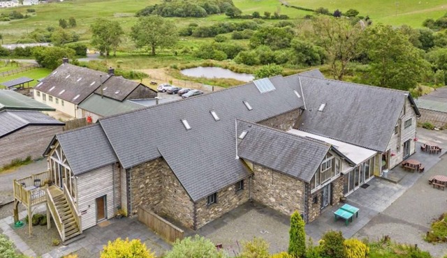 Luxury renovated barn in the countryside, with10 bedrooms and 10 bathrooms. Including a large hot tub/rehab spa, full size football pitch, games room and electric car charging.