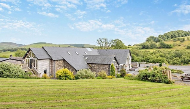 Luxury renovated barn with a large hot tub and games room. Located in the beautiful Welsh countryside with stunning scenery and great hiking trails. Pet and family friendly.