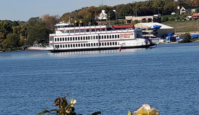 Luxury river front two-bedroom carriage house with private deck and hot tub.