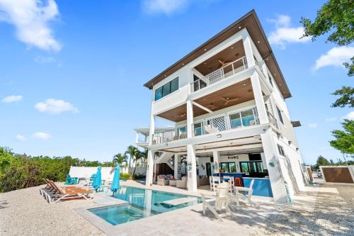 Luxury Seaside Escape ~ Heated Pool w Jacuzzi ~ Elevator ~ Dock ~ Scenic Views
