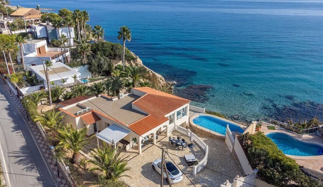 Luxury villa with its own swimming pool, directly by the sea, stairs to the see.