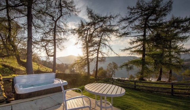 Luxury waterfall cottage with private hot tub at Loch Tay