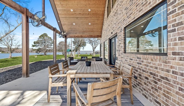Luxury waterfront new home w/panoramic views, private dock & firepit