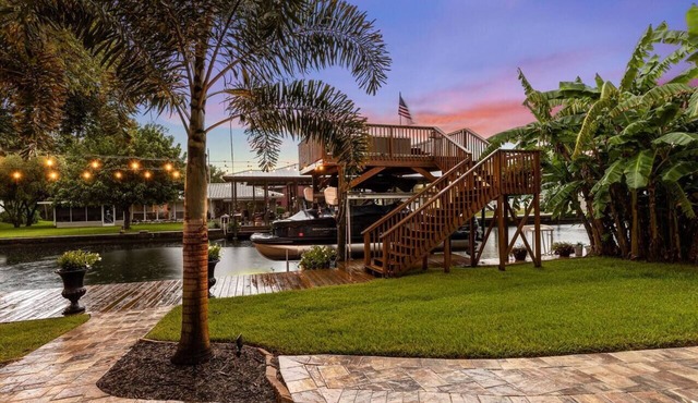 Luxury Waterfront Pool Home w/spa & deep canal