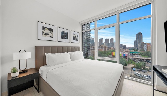 Luxury West Loop Stay: Modern Suites w/Balcony, Resort Amenities & City Views