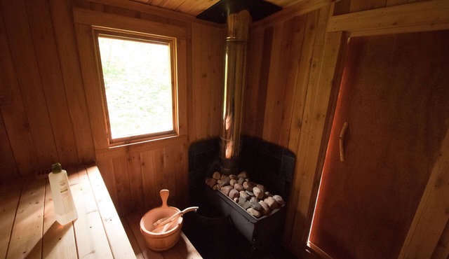 Mökki Hovland Hut - A Unique Glass Wall Timber Frame Nestled in a Maple Forest