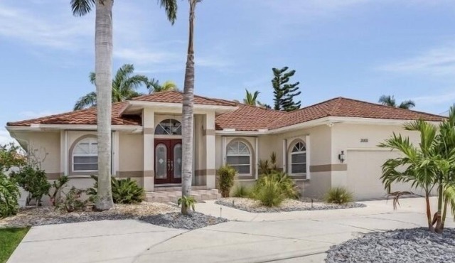 MAGNIFICENT! LUXURY WATERFRONT HOME;BIG HEATED POOL-80’ DOCK! 5 MIN FISH VILLAGE