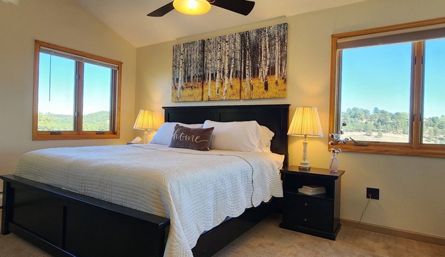 Main floor master, gourmet kitchen, and Hot tub with amazing mountain views