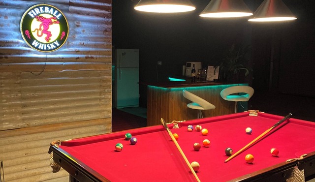 Man Cave with a touch of Lux. and an open fire.