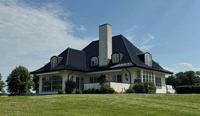 Manor house overlooking fields and garden