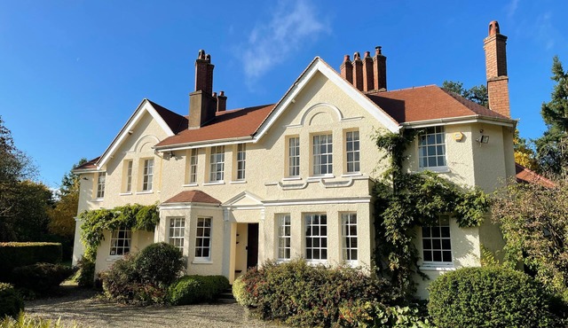 Manor house set in five acres of gardens with private golf course, near Ludlow.