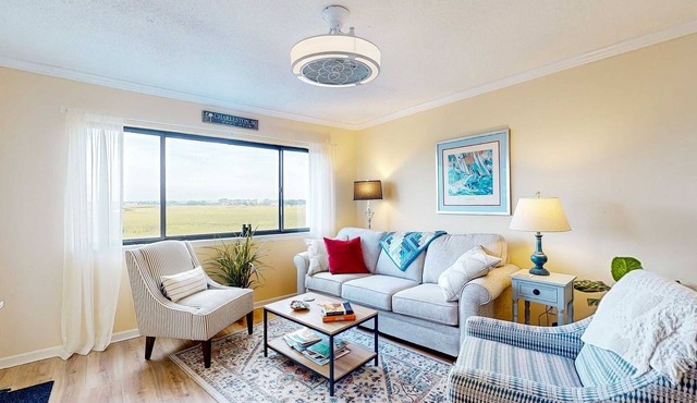 Marsh-view condo with on-site pool, tennis, & private balcony