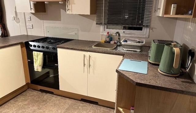 Metres from the beach. Cosy, family friendly mobile home with decking.