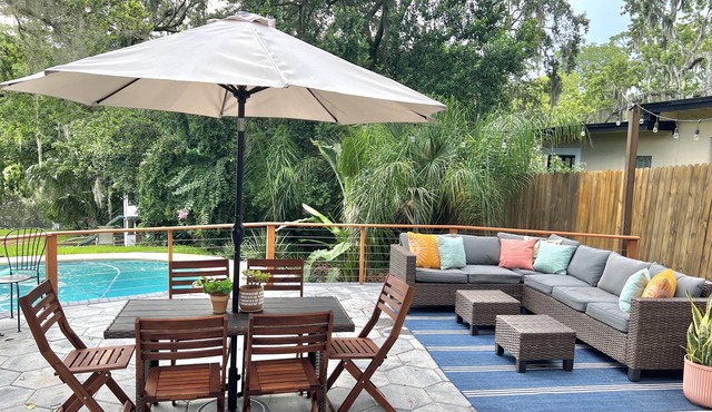 Mid-Century Boho Chic home with Pool, Game Room & Outdoor Playhouse.