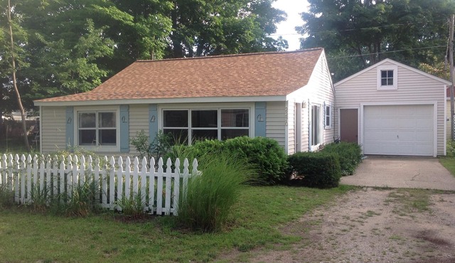 Mid century cottage next to Holland State Park