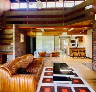 Mid-century lake front house with Sauna