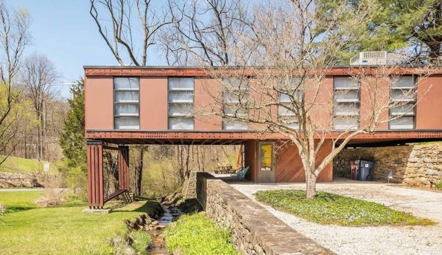 Mid Century Modern Getaway with secluded hot tub and fire pit.