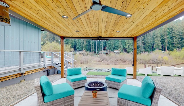 Mid-century, riverfront home with hot tub & redwood views - dog-friendly