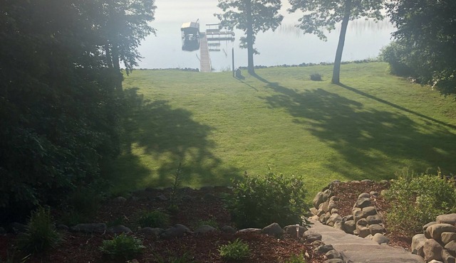 Mission Lake home with dock and sandy bottom