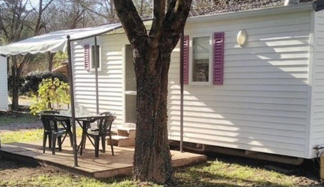 Mobile home with terrace and garden furniture