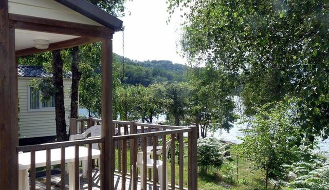 Mobile home beside a lake for fishing, calm, nature