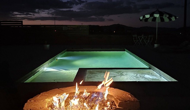 Modern 1-bedroom studio with peaceful mountain views, firepit, pool and hot tub.