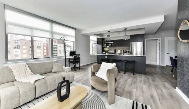 Modern 2BR Oasis with Scenic Rooftop & Gym