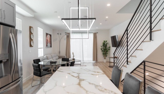 MODERN 3-4 BEDROOM TOWNHOME BUILT IN 2023 WITH OFFICE, BONUS ROOM, 2-CAR GARAGE WITH EV CHARGER & 2 BALCONIES (p63)