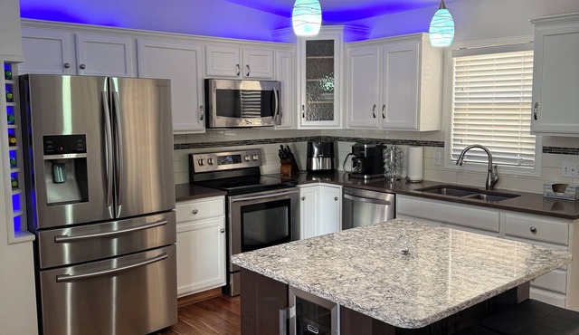 Modern 3-bedroom, 3 full bath, 2 living areas, 2 kitchens, game room, hot tub!