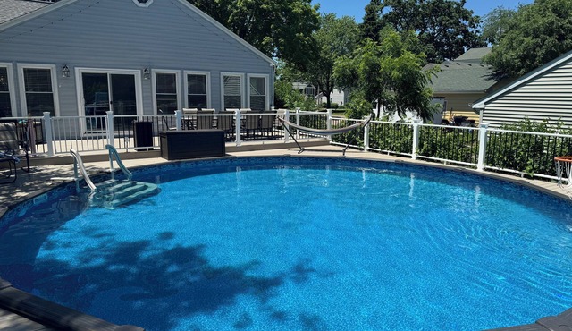 Modern 3 BR with a huge fenced yard and heated pool right by downtown