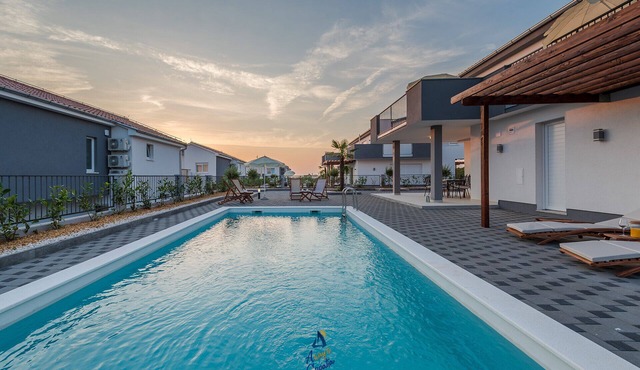 Modern 4 BD villa with heated pool for up to 8 guests
