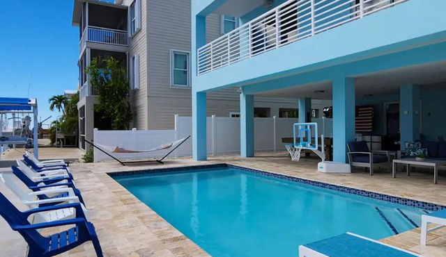 Modern 4 bedroom Keys home “Salt Life” with a pool. This home is on the Canal.