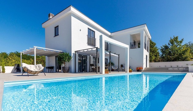 Modern 5* villa with a private pool in an idyllic surrounding..