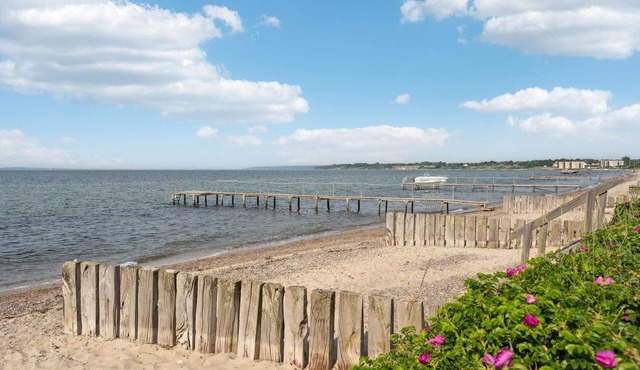 Modern and beautiful wooden house, just a few 100 meters from the family friendly sandy beach.