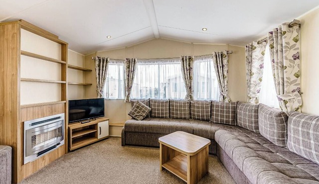 Modern and contemporary 12ft-wide caravan with one double and one twin.