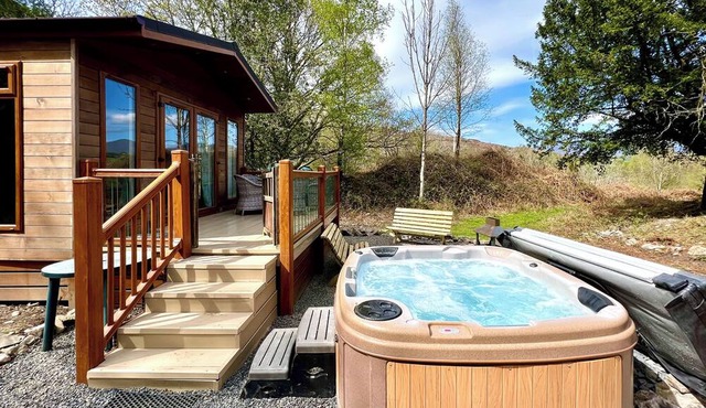 Modern and contemporary lodge style holiday home set in woodland area.