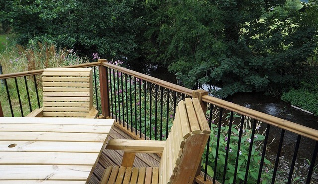 Modern and contemporary lodge on a riverside setting.