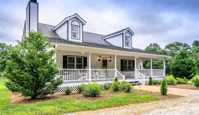 Modern and spacious home surrounded by scenic willow trees.