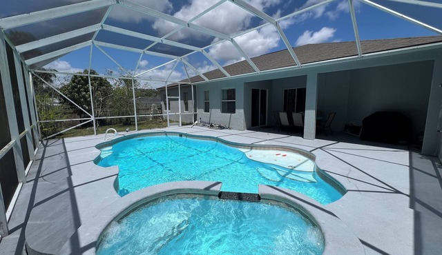 Modern and spacious getaway with a pool and grill
